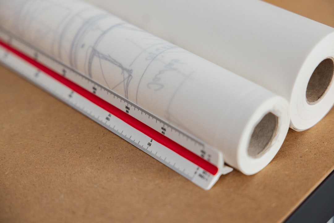Design CAD Kanopi - a close-up of a white tube with a red label