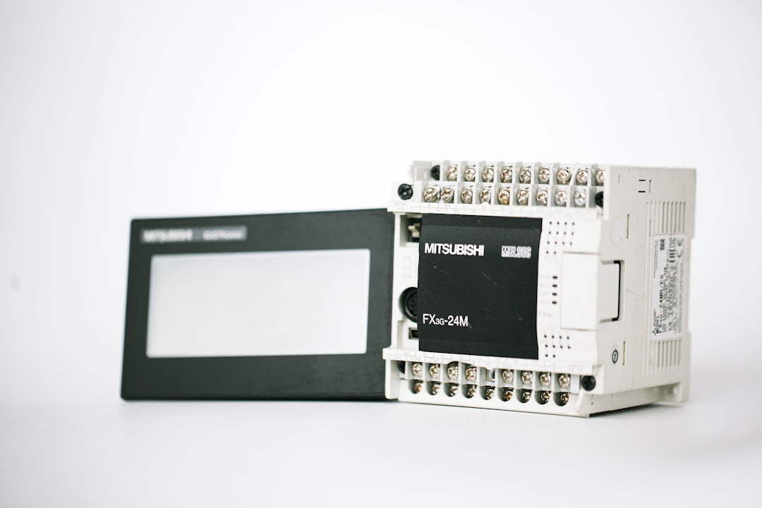 a black and white electronic device on a white surface