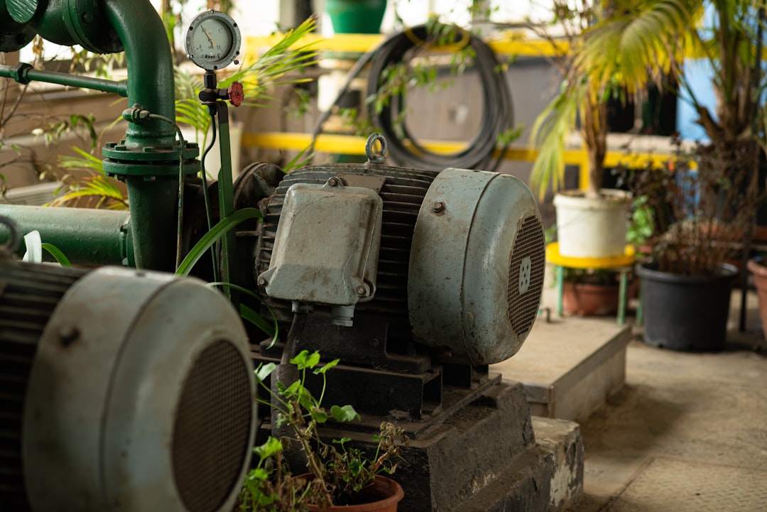 a large green machine sitting inside of a building
