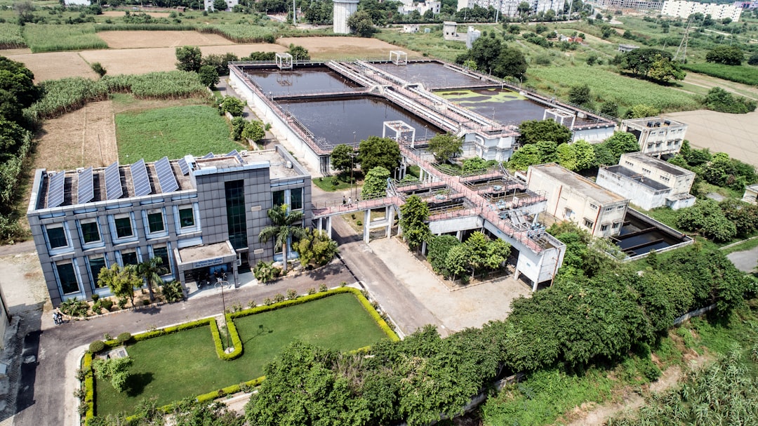 Aerial view of a water treatment plant with surrounding fields.