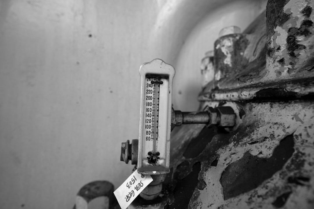 A close-up of a flow meter on industrial equipment.