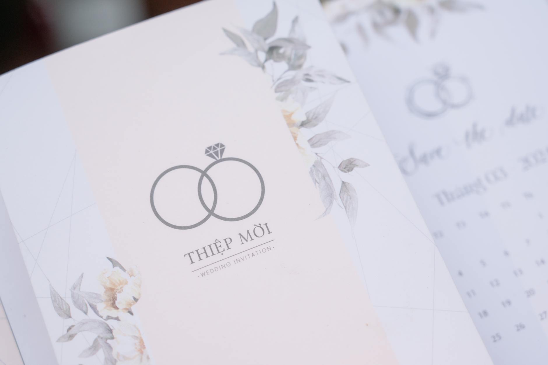 A beautifully designed floral wedding invitation with subtle pastel colors and elegant typography.