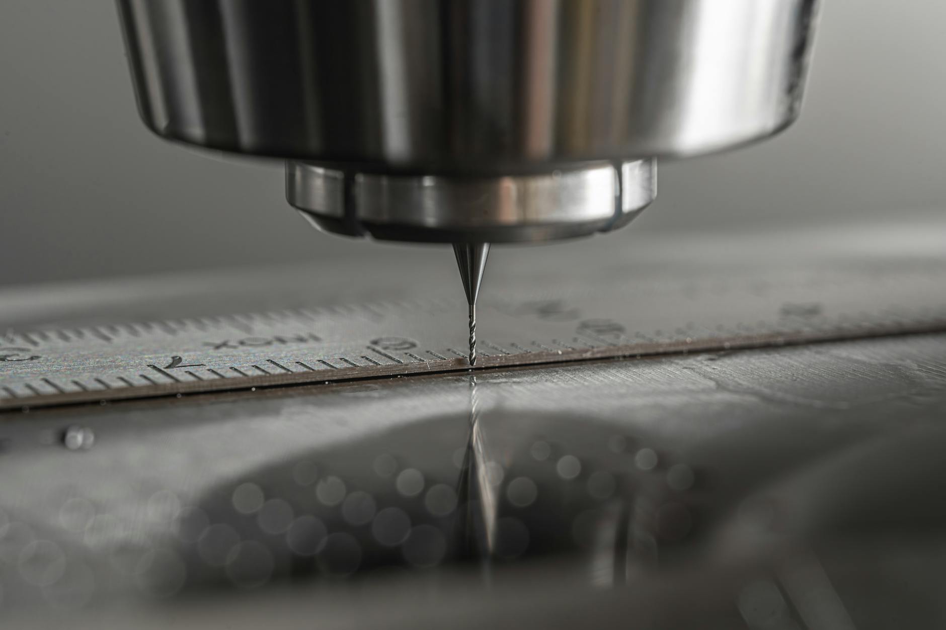 Detailed close-up of a CNC milling machine working on metal, showcasing precision and industry technology.