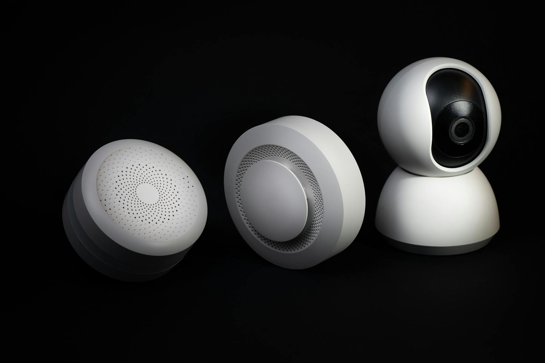 Elegant and innovative home automation devices on a sleek black background, showcasing modern technology.